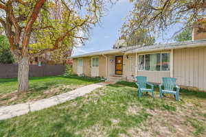 View of front of property featuring a chimney