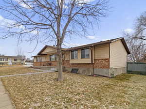 View of front of home featuring brick siding