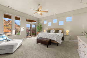 Bedroom featuring access to exterior, light colored carpet, and ceiling fan