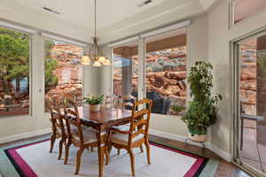 Dining space with a chandelier and baseboards