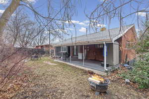 Rear view of house with roof with shingles