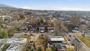 Aerial view of property's location with nearby suburban area