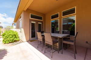 View of patio with outdoor dining area and french doors
