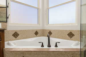 Full bath with a bath and vanity