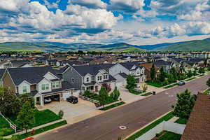 Aerial perspective of suburban area with a mountainous background