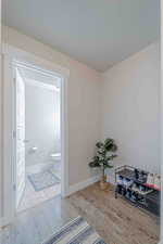Unfurnished room with light wood-type flooring and a textured ceiling