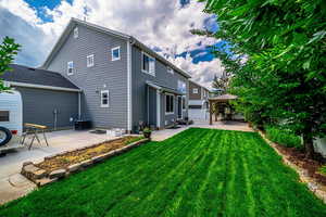 Rear view of house with a patio area and a gazebo