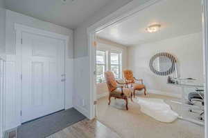 Entryway featuring a textured ceiling and wood finished floors