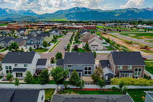 Aerial perspective of suburban area featuring a mountain backdrop