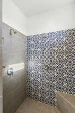 Full bathroom featuring tiled shower