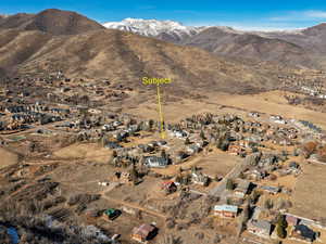 Aerial perspective of suburban area with a mountain backdrop