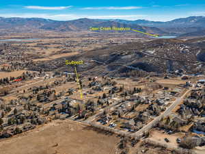 Aerial perspective of suburban area featuring a mountainous background