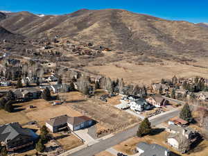 View of mountain background featuring nearby suburban area