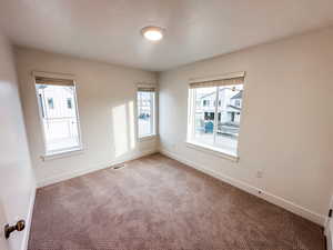 secondary bedroom with extra end unit window