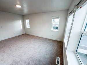 Primary bedroom with two additional end unit windows