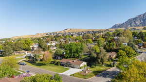 Aerial perspective of suburban area with a mountain backdrop