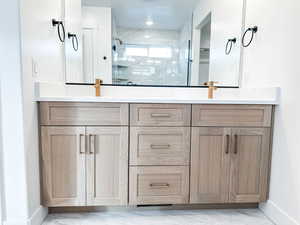 primary bathroom with double vanity sinks