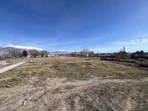 View of yard with a view of countryside and a mountain view