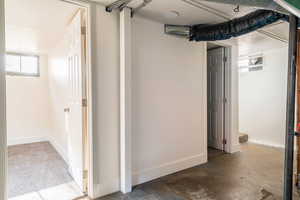 Basement featuring baseboards