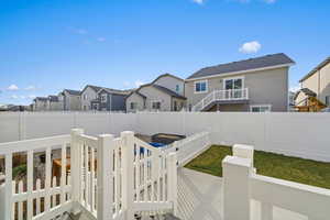 Fenced backyard and a patio area