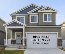 Craftsman house with board and batten siding, brick siding, a porch, an attached garage, and driveway