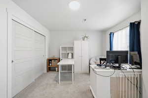 Office area featuring light colored carpet