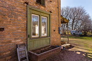 Entrance to property with stone siding