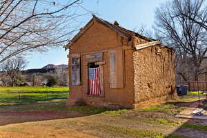 View of home's exterior featuring an outdoor structure