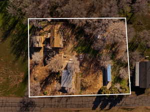 Aerial view of property and surrounding area with property parcel outlined