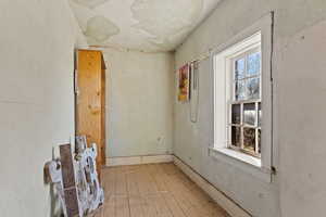 Unfurnished room with hardwood / wood-style flooring