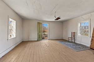 Empty room with wood-type flooring