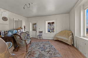 Sitting room with wood finished floors