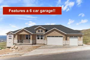 View of front of home featuring stone siding, a porch, an attached garage, and driveway