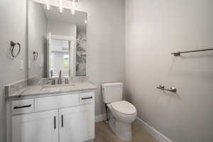 Full bathroom featuring vanity and a marble finish shower