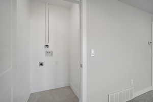 Washroom featuring electric dryer hookup and hookup for a washing machine