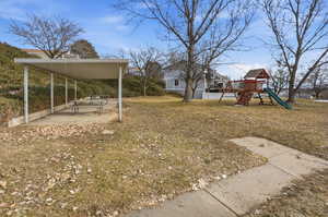 View of yard featuring a playground