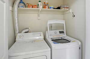 Washroom with washing machine and dryer