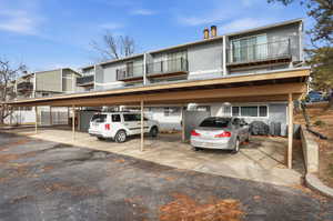 View of front of property featuring covered parking
