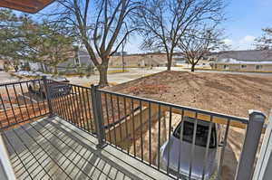 Wooden deck with a residential view