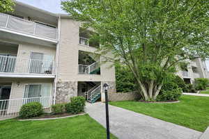 View of apartment building / complex featuring stairs