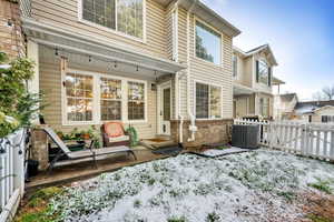 Rear view of property with a patio area and a gate