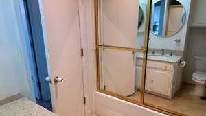 Full bathroom with vanity and combined bath / shower with glass door