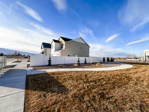 View of the side property being surrounded by fully landscaped common area.