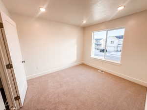 Secondary bedroom with walk-in closet