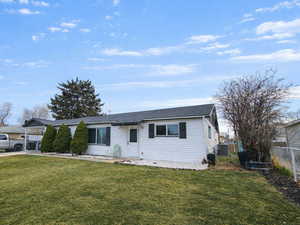 Ranch-style house featuring a patio area, driveway, and a shingled roof