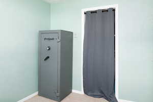 Basement bedroom with above grade windows, and carpet.
