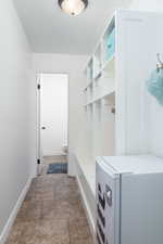 Mudroom featuring storage cubbies.