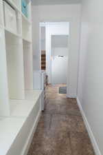 Mudroom featuring storage cubbies.