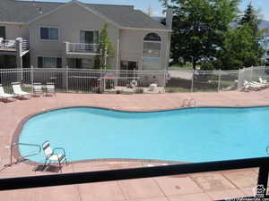 Harbor Village pool featuring a patio area