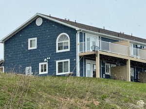South side of property with a deck and patio